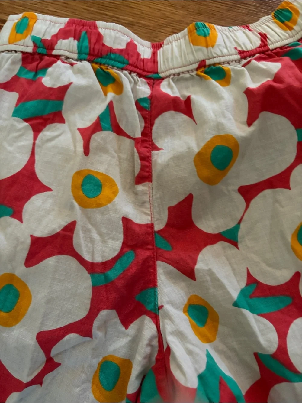 Hanna Andersson White Floral swim shorts with Red, Yellow & Teal Accents